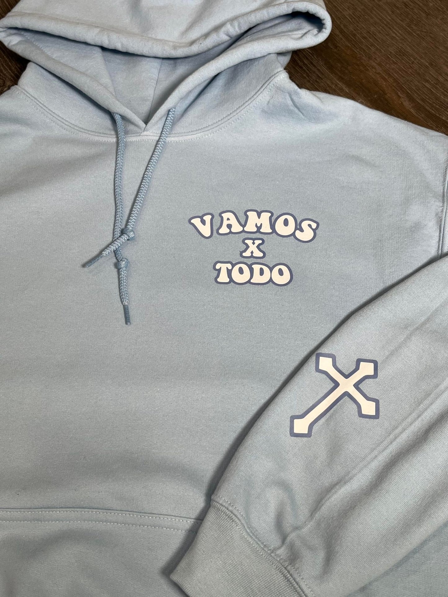 CON LA AYUDA DE DIOS - BABY BLUE UNISEX HOODIE